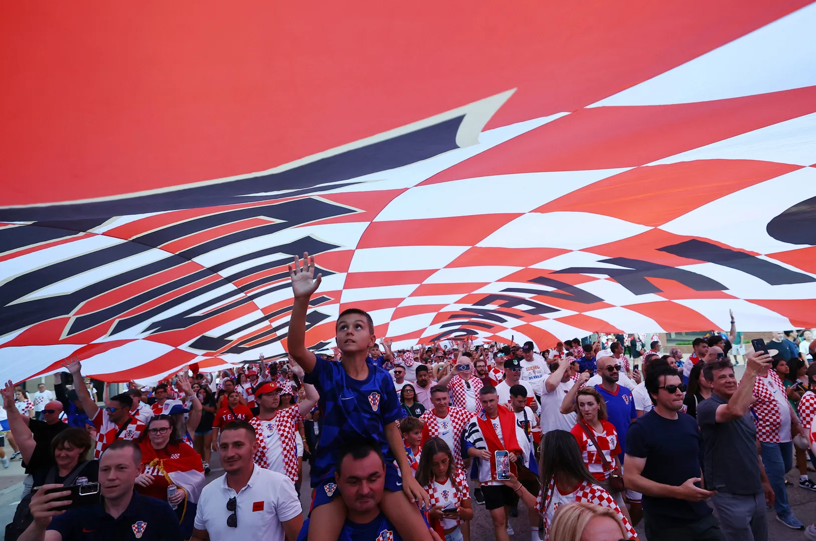 Croatia fans rock cowboy style in Dallas parade ahead of match with England