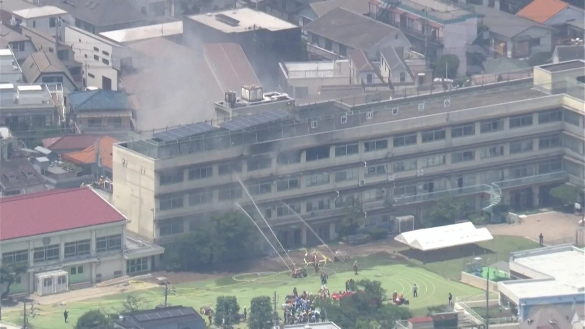 Dramatic rescue as fire rips through school in Japan