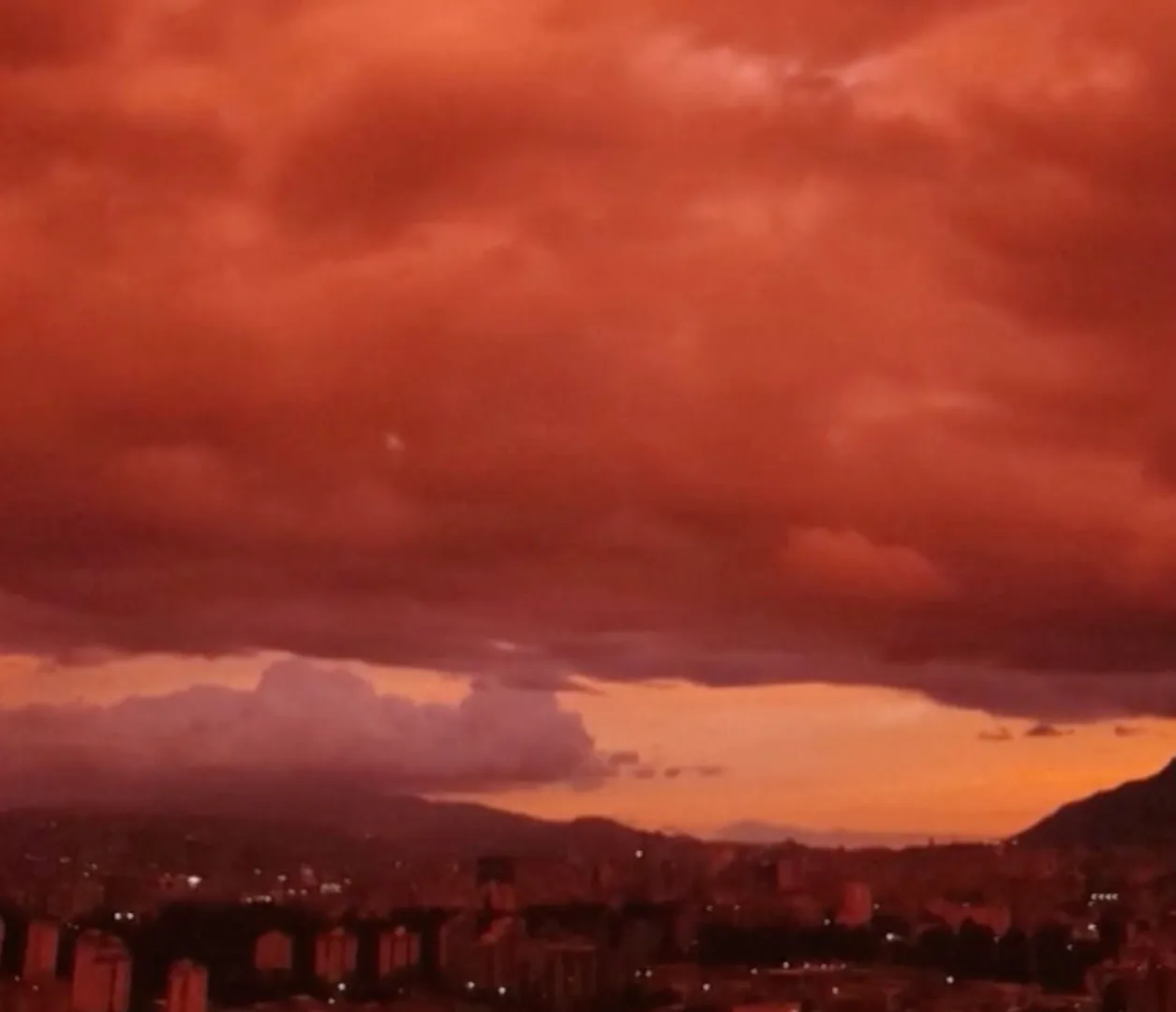 Venezuelan sky turns deep red as sun sets over Caracas